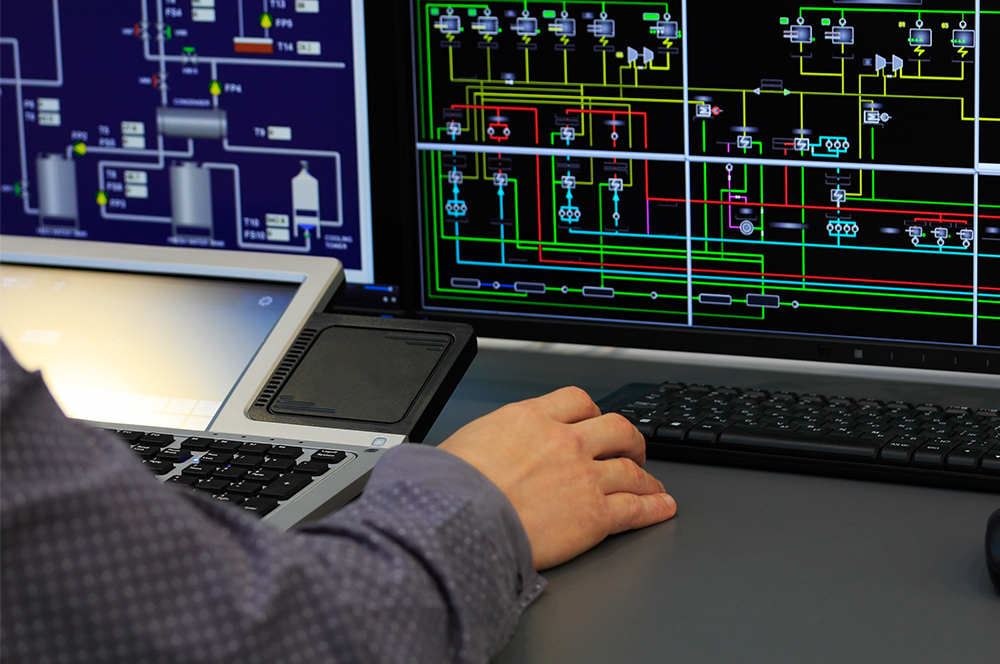 Solutions_SCADA_2_1000x664 Close up of person working on a SCADA screen